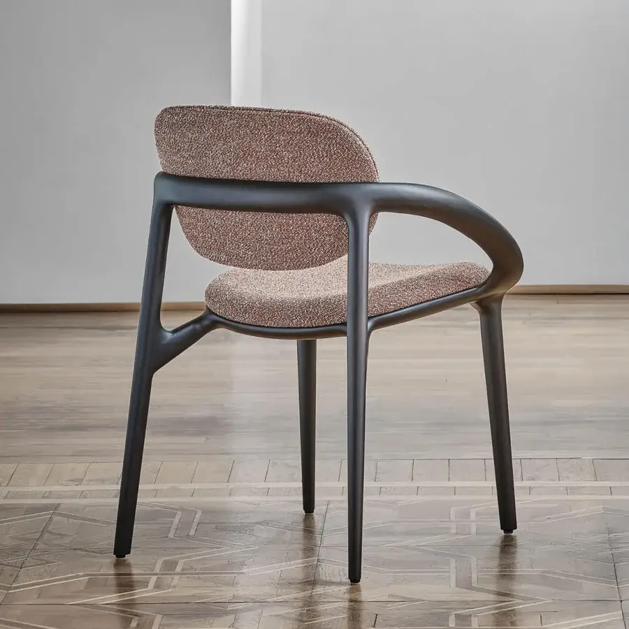 Distinguished Porada Molly armchair with a canaletto walnut frame and textured warm brown beige textile upholstery with a matte finish
