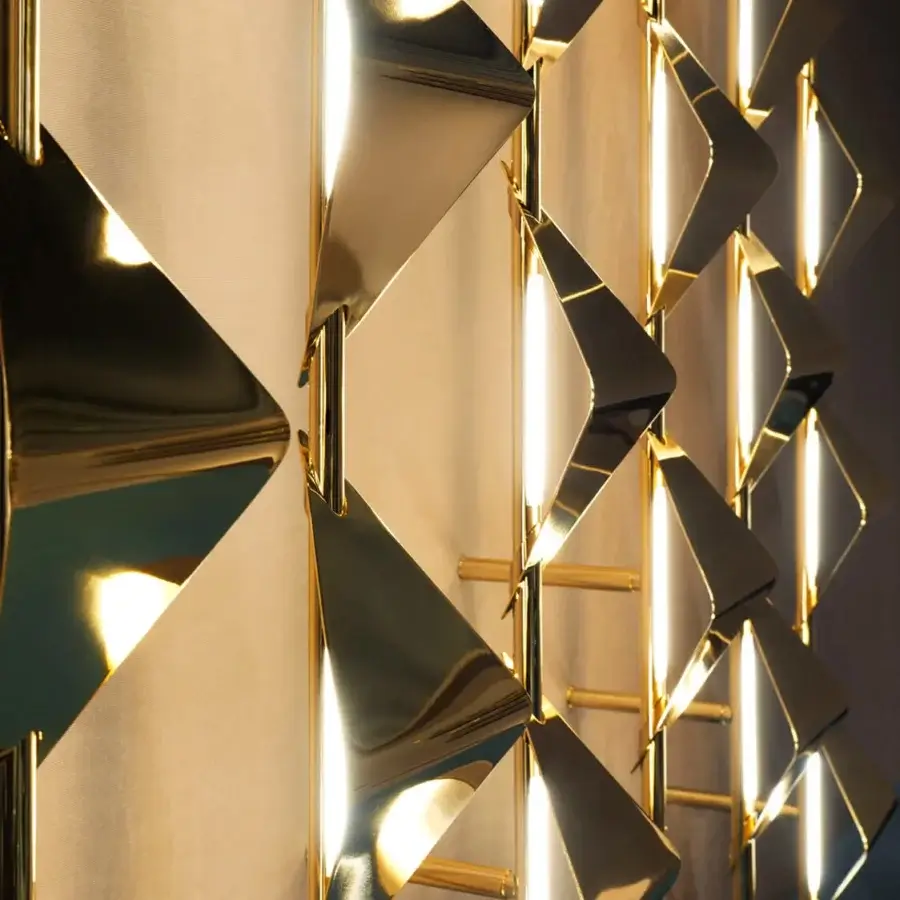 Superior Visionnaire Sputnik wall lamp built in tubular steel with a glossy warm gold finish and angled geometric shades