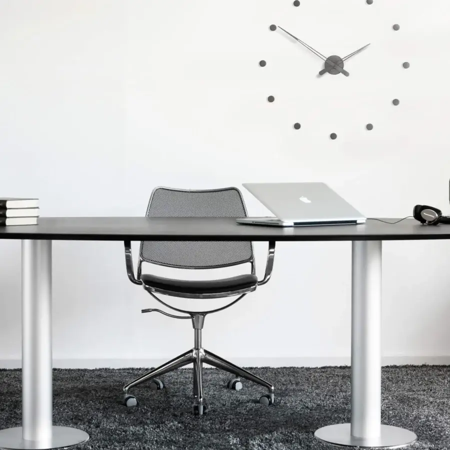 Superior Nomon Rodón wall clock with sculptural metal hour markers and hands in dark gray with a matte finish