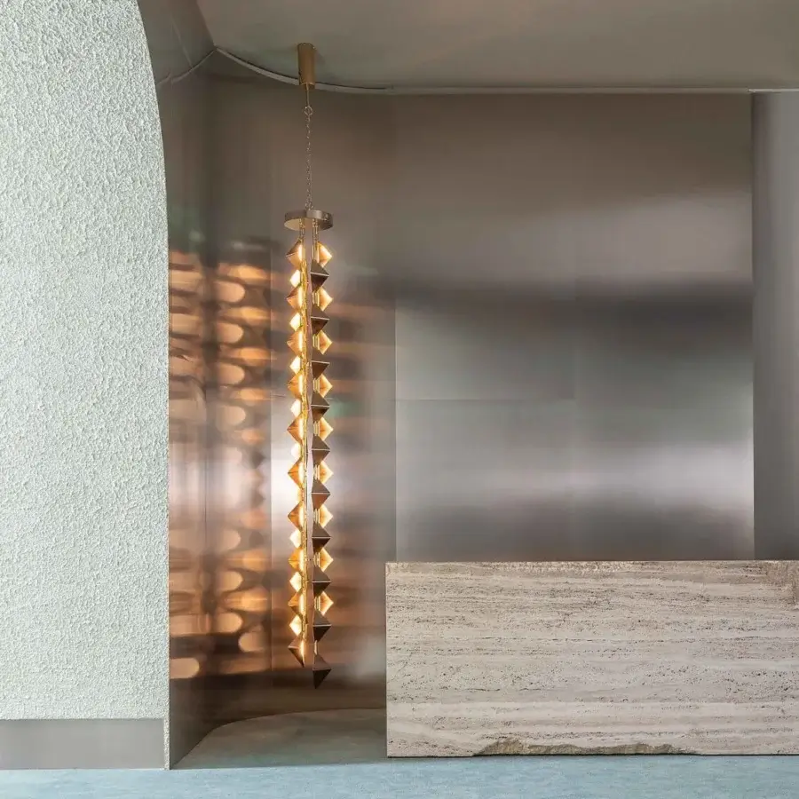 Exclusive Visionnaire Sputnik chandelier with tubular steel and glossy cold-deformed rhomboidal diffusers radiating golden light