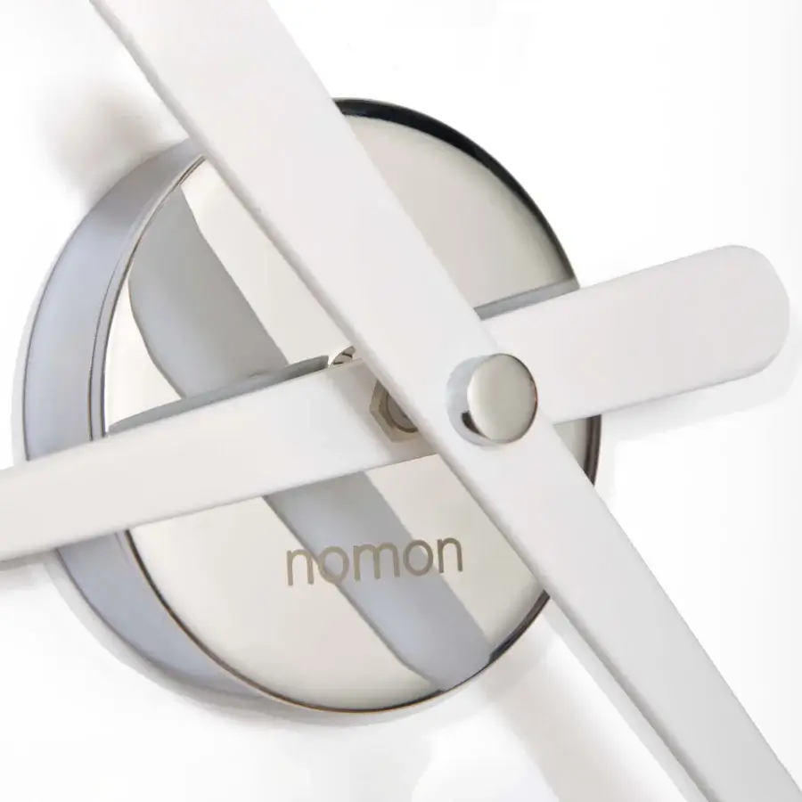 Elegant Nomon Rodón Mini L wall clock with a satin gray-white face and lacquered walnut hands