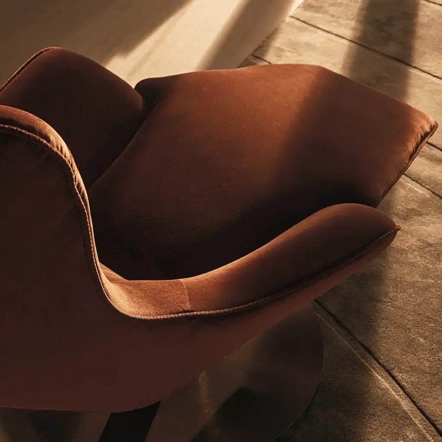 Lavish Visionnaire Selfless lounge chair with reddish-brown textile upholstery and molded birch plywood shell in matte finish