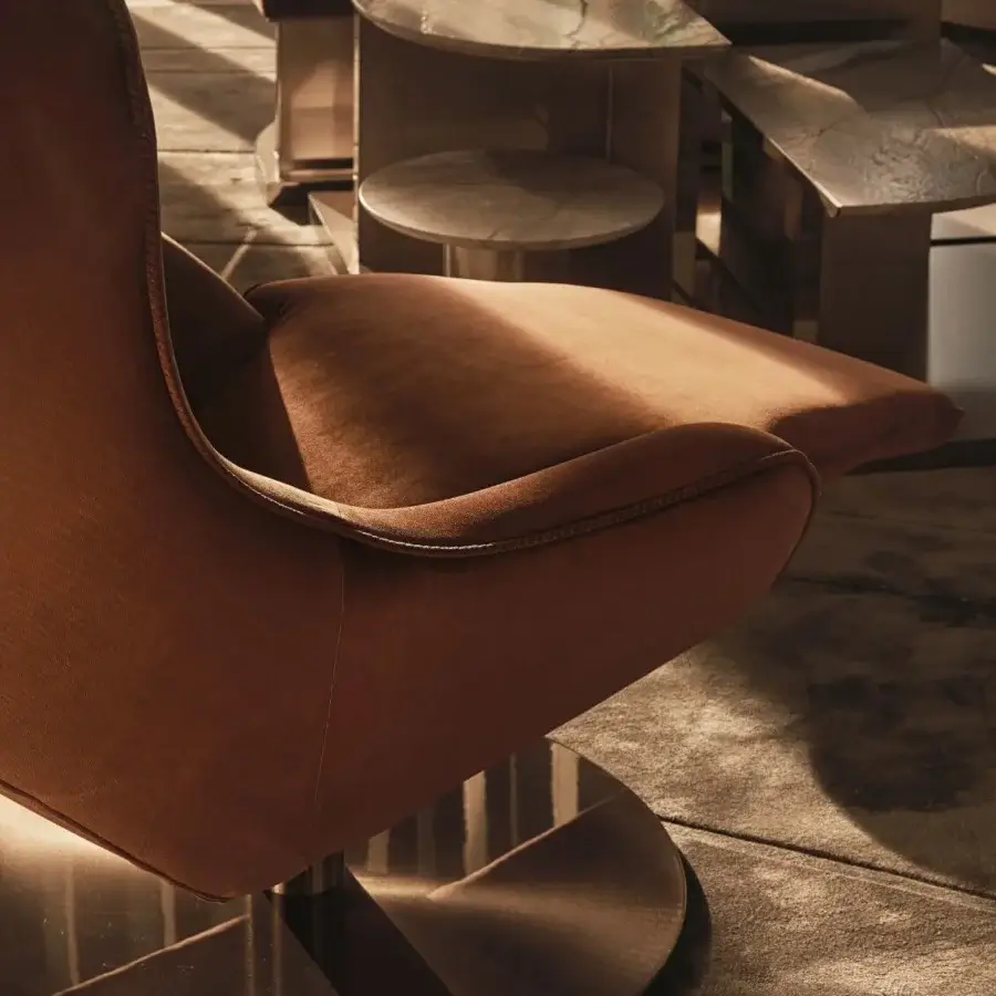 Distinguished Visionnaire Selfless lounge chair with terracotta textile upholstery and satin-finish steel base