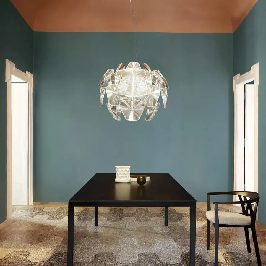 Exceptional Luceplan Hope suspension lamp with a dynamic petal-like form crafted in clear glossy methacrylate lenses