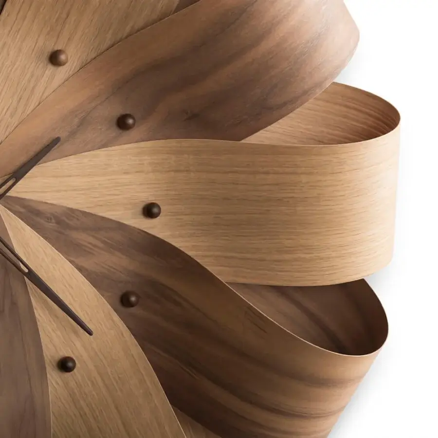 Distinguished Nomon Brisa Wall Clock crafted in walnut wood with a satin finish and floral-inspired form