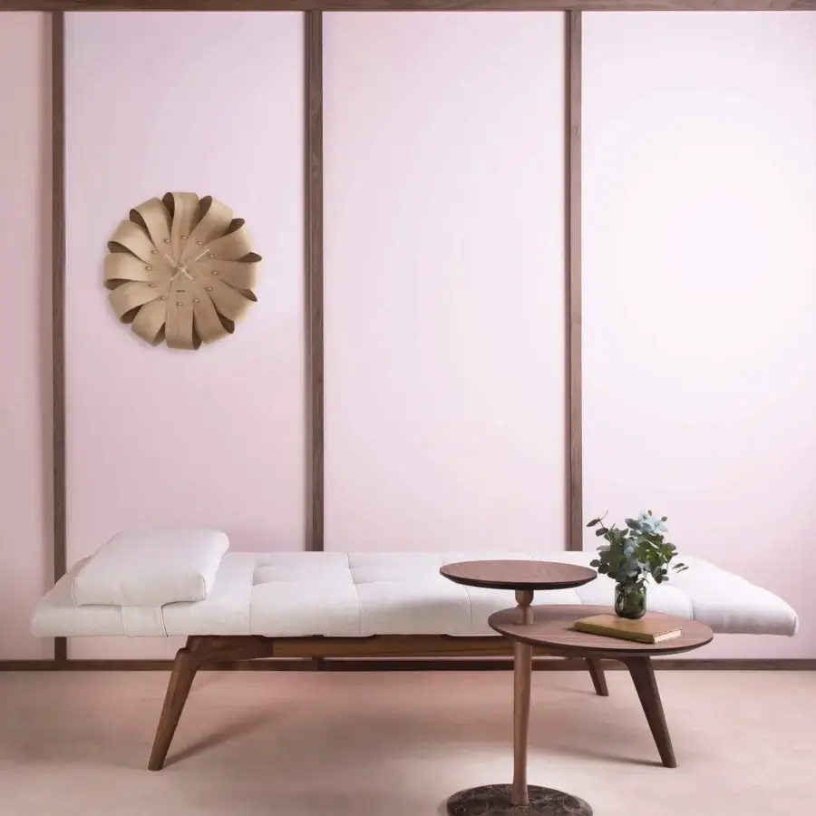 Distinguished Nomon Brisa Wall Clock crafted in natural oak with a smooth satin finish and flower-like sculpted petals