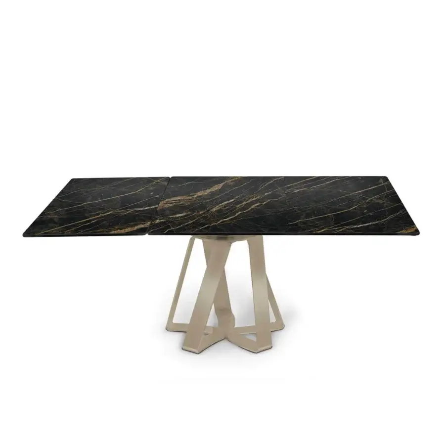 Superior Naos turning table with a ceramic tabletop displaying golden veining and a satin steel base