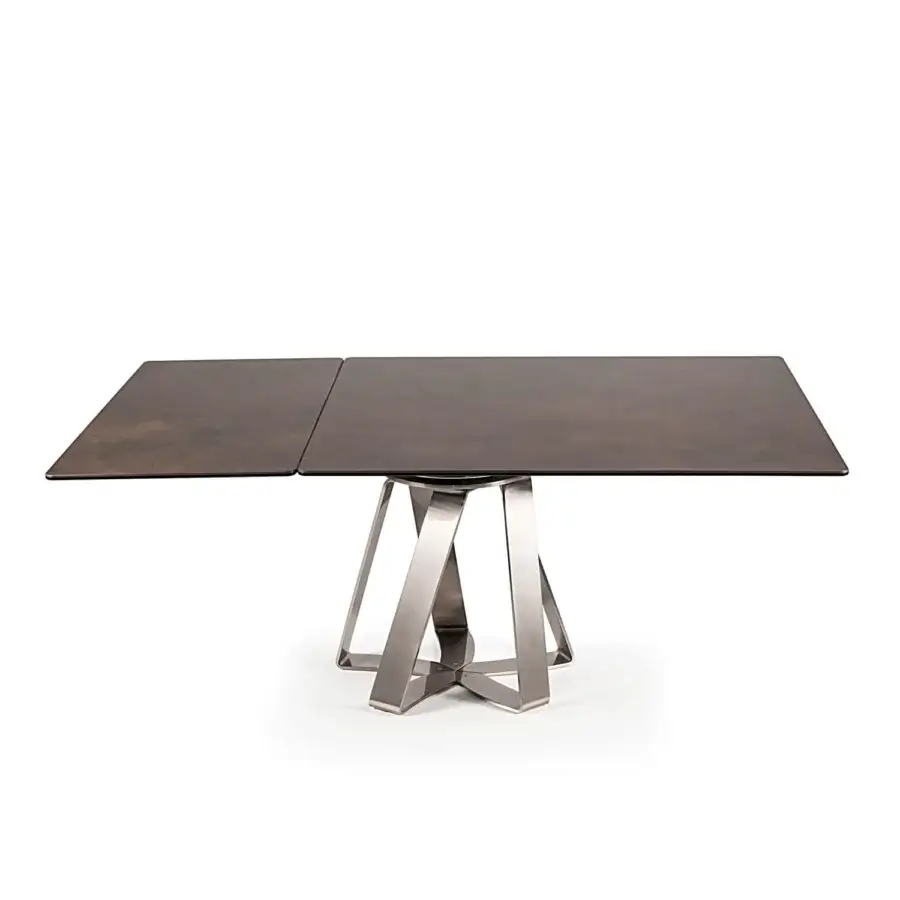Exceptional Naos turning table with a mottled ceramic tabletop and sculptural brushed metallic grey steel base