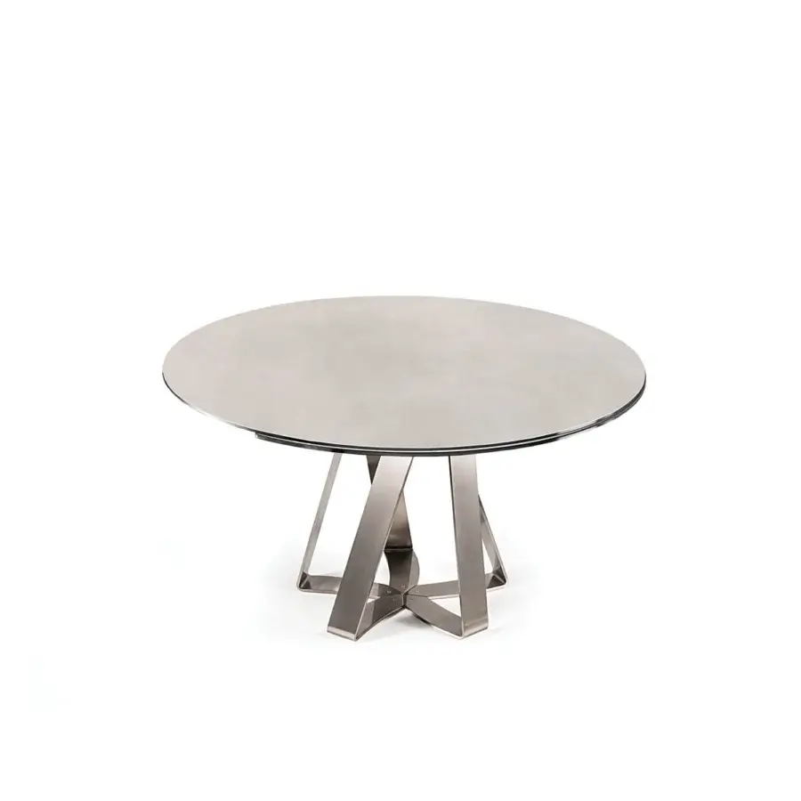 Distinguished Naos turning table with ceramic top and sculptural steel base in a galvanized finish