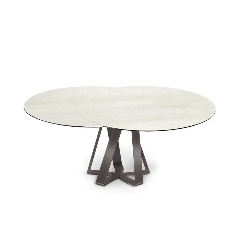 Distinguished Naos turning table with light grey ceramic top exhibiting a mottled texture and dark satin steel base