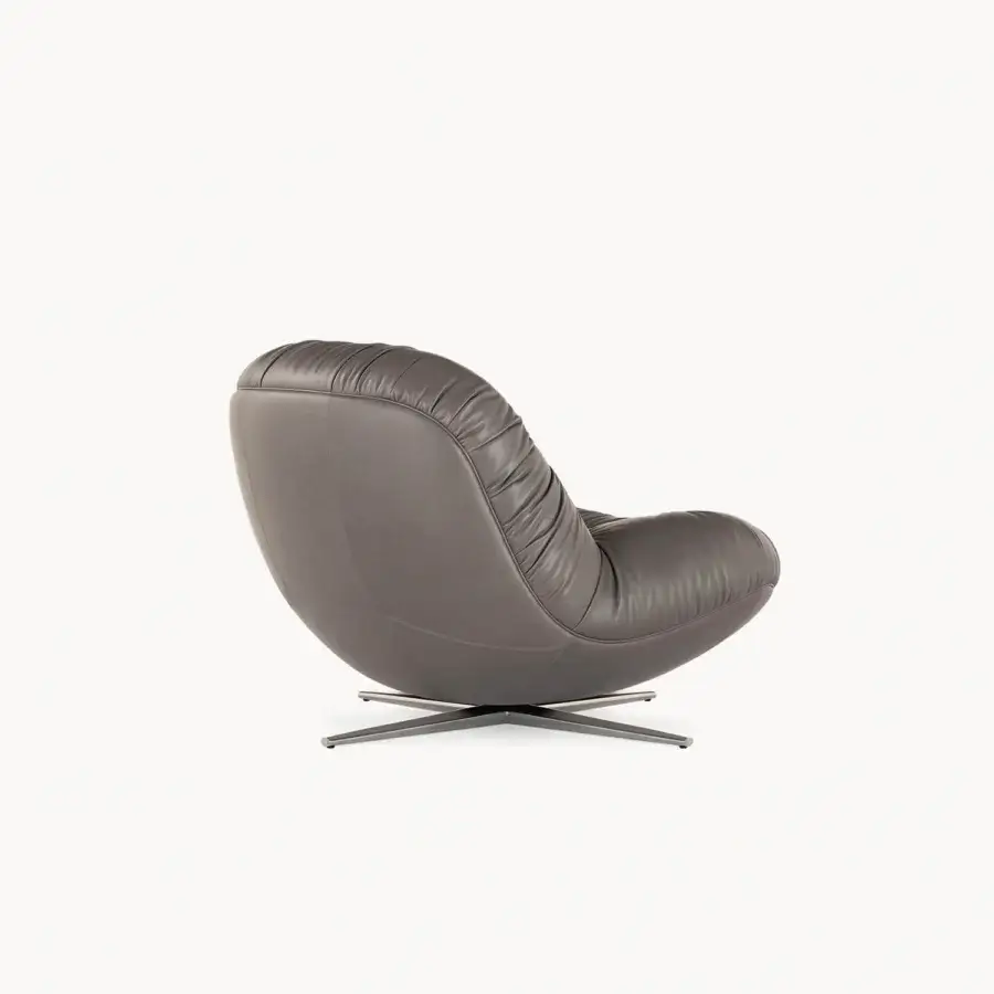 Distinguished Visionnaire Aura lounge chair with sculpted wooden shell upholstered in premium leather and satin metal finish