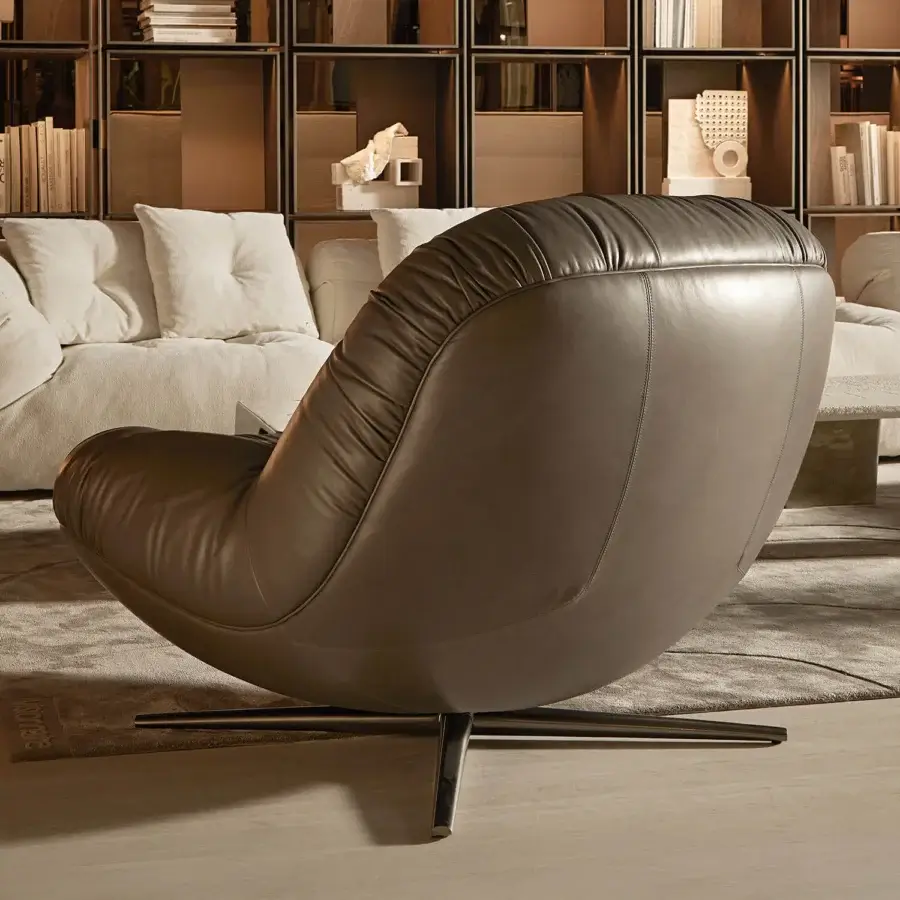 Exceptional Visionnaire Aura lounge chair with sculpted wooden shell upholstered in smooth medium-brown leather and satin metal swivel base