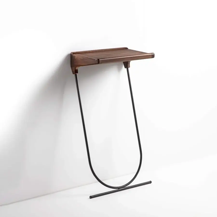 Refined Porada Maori console built with a solid canaletta walnut top and pewter grey metal frame with a satin sheen