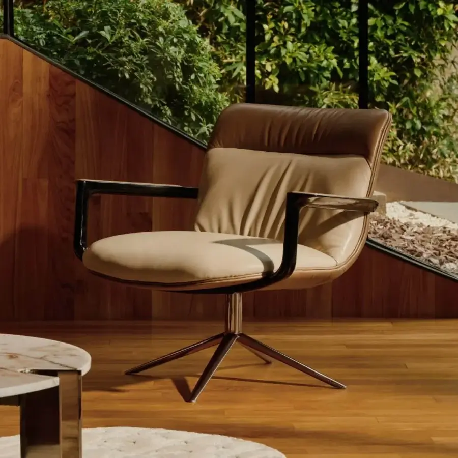 Distinguished Visionnaire Spectre lounge chair with lavish leather backrest and neutral beige textile seat supported by polished stainless steel base
