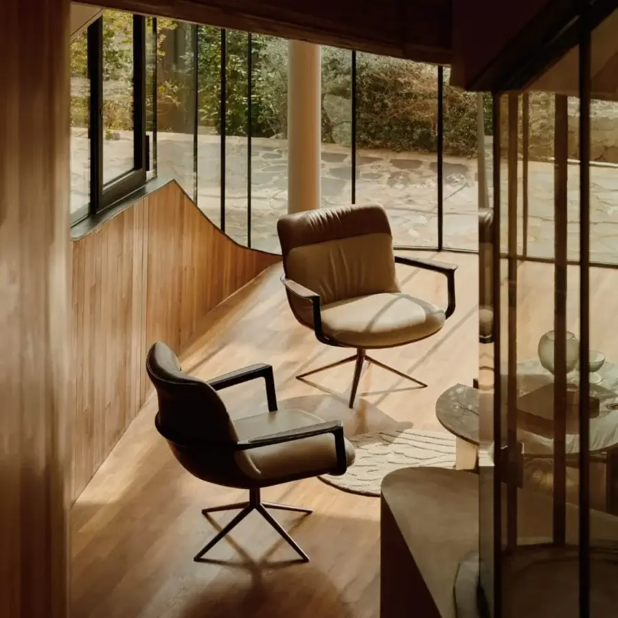 Superior Visionnaire Spectre lounge chair with sculpted form and sumptuously padded medium-brown leather upholstery with polished stainless steel base