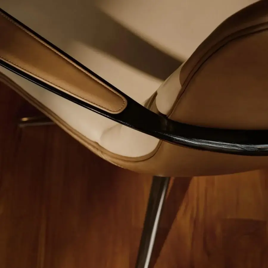 Captivating Visionnaire Spectre lounge chair with golden-brown leather upholstery and high-gloss varnished solid ash armrests