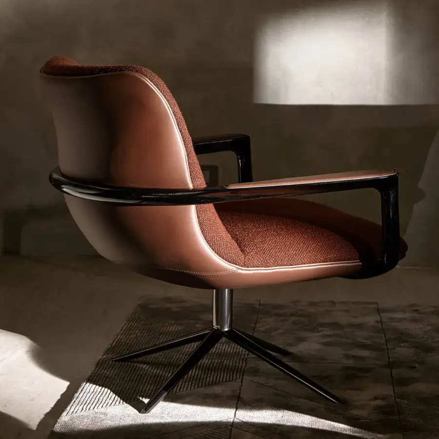 Lavish Visionnaire Spectre lounge chair with reddish-brown leather, textured fabric, polished stainless steel base and high-gloss ash armrests