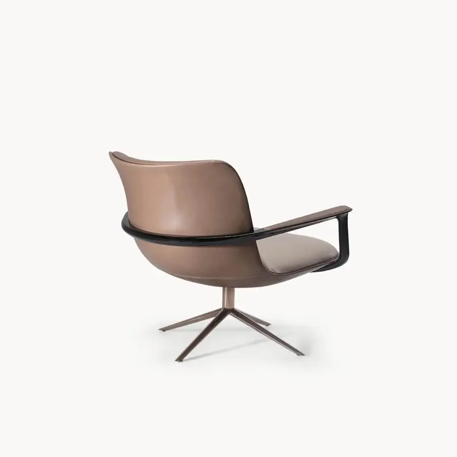 Exclusive Visionnaire Spectre lounge chair with sculpted form, premium leather upholstery and polished stainless steel swivel base