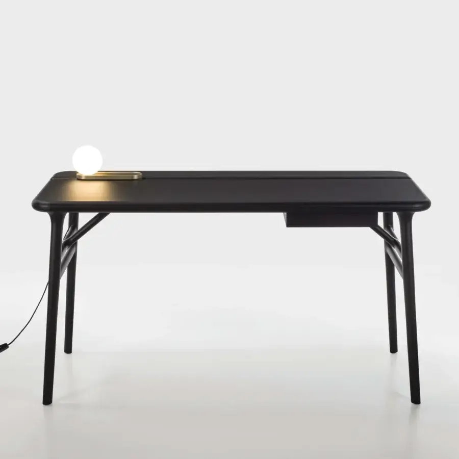 Distinguished Porada Aksel desk with solid Canaletto walnut and a matte finish, showcasing a striking two-part top and integrated drawer