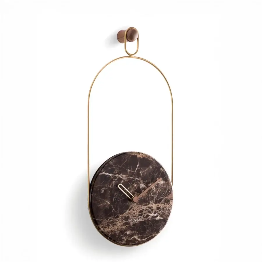 Architectural Nomon Eslabón Wall Clock with a marble plate suspended in a gently curved gold-toned metal frame and satin finish