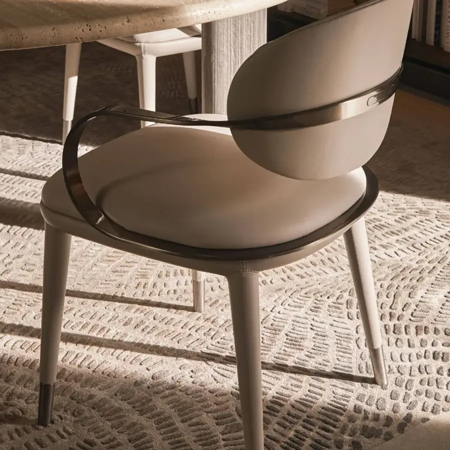Superior Visionnaire Elixir armchair in matte beige textile with twisted curved metalwork and tapered beechwood legs