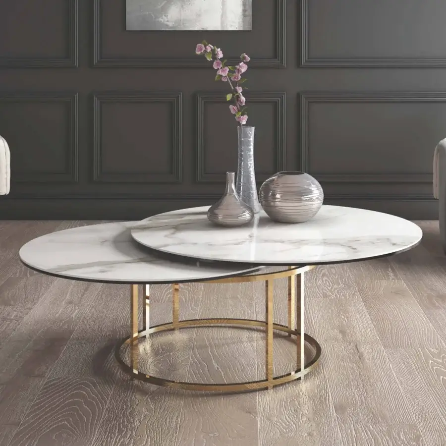 Distinguished Naos Colombo coffee table with a round ceramic top and golden-toned galvanized steel base in a satin finish