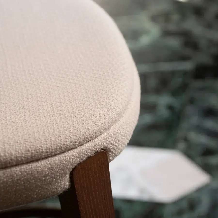 Elegant Potocco Minima stool with muted beige textile upholstery and a satin gold finished solid ash wood frame