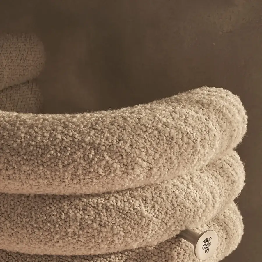 Distinctive Visionnaire Voluptas stool upholstered in textured pale beige bouclé with a turned stainless steel stem