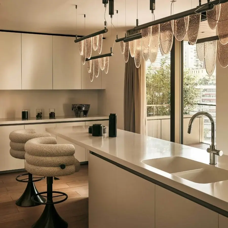 Elegant Visionnaire Voluptas stool upholstered in textured neutral beige fabric with satin finished stainless steel stem