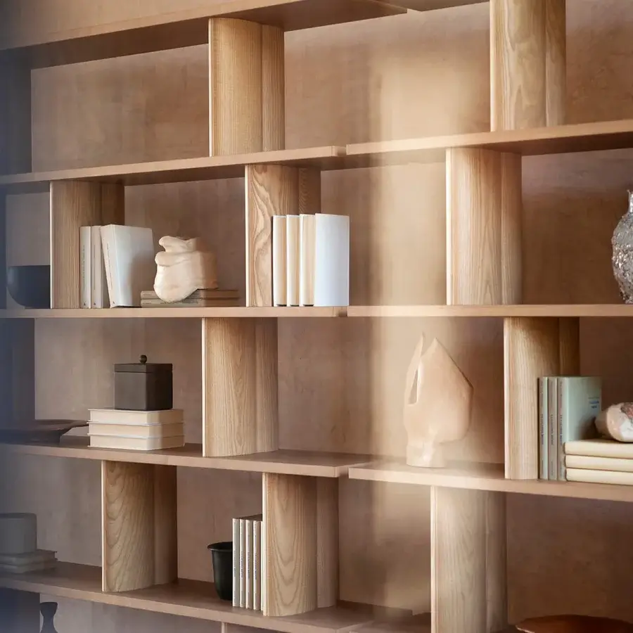 Elegant Potocco Pages bookshelf in sinuous solid ash wood with a light brown matte finish
