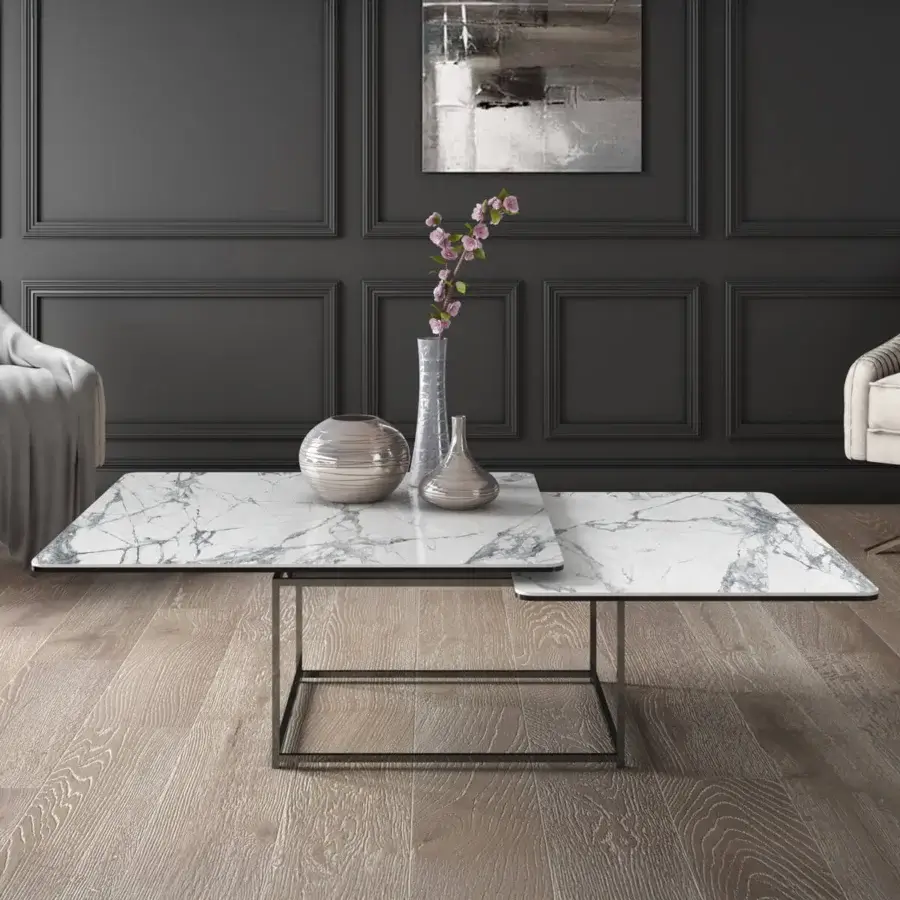 Distinguished Naos Magellano coffee table with white and grey veined ceramic top and dark matte painted steel base transforming with fluid motion
