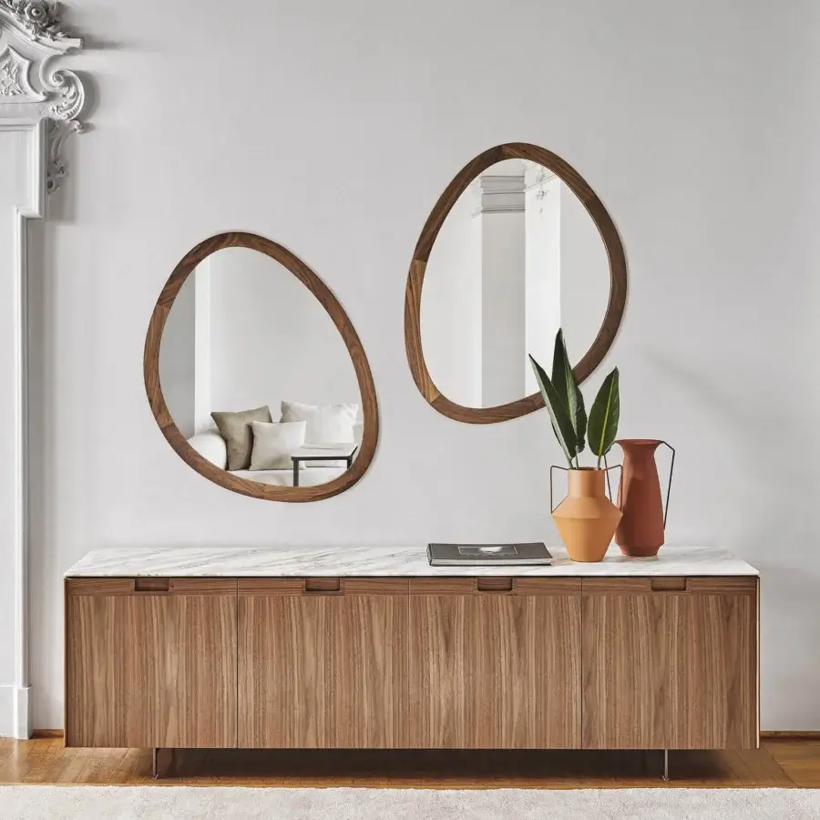 Distinguished Porada Matics 4 sideboard with warm wood doors, pewter base, and a light stone top with subtle veining