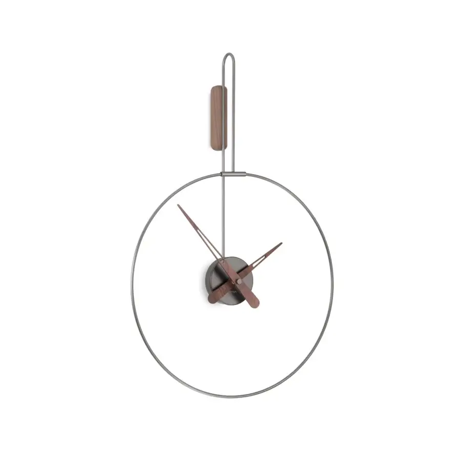 Elegant Nomon Micro Daro wall clock crafted with polished brass, warm walnut wood hands and muted silver-grey metal components