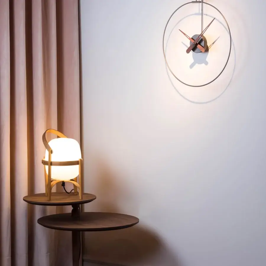 Superior Nomon Micro Daro wall clock with delicate walnut wood hands and polished brass bezel
