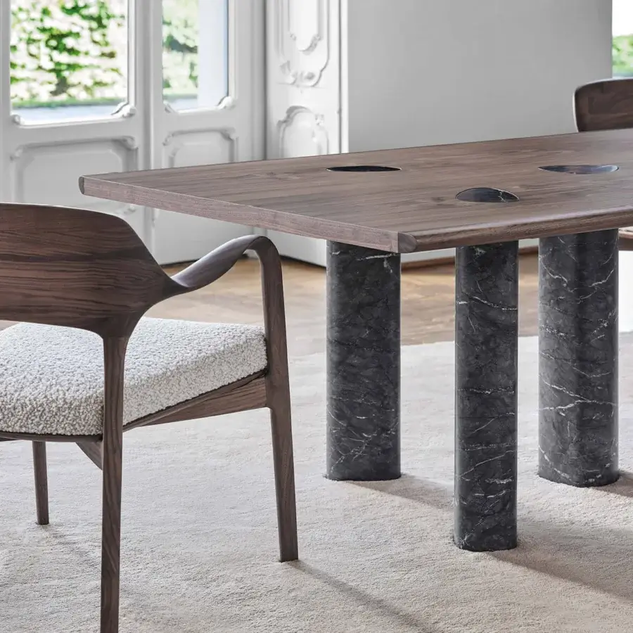 Distinguished Porada Osmose table crafted in canaletto walnut with droplet marble inserts and polished dark grey marble legs with matte finish