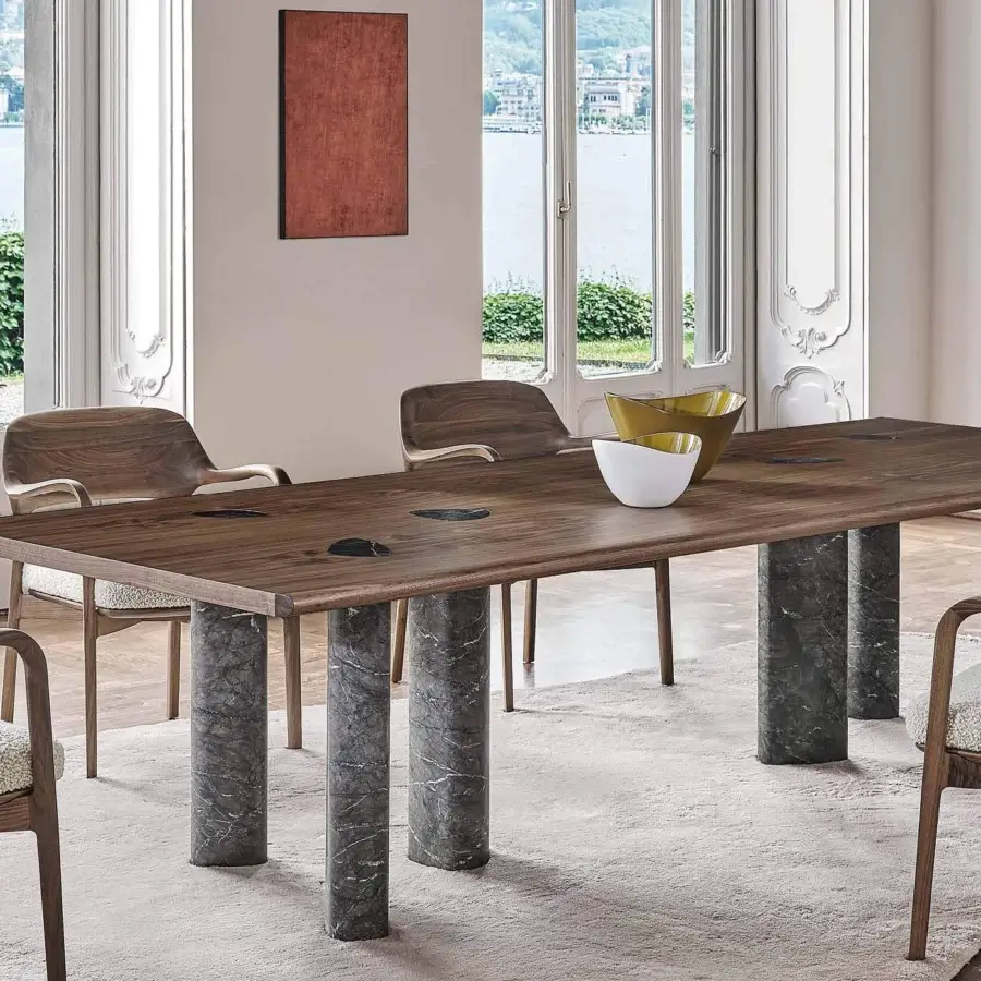 Distinguished Porada Osmose table crafted in canaletto walnut with matte finish and delicate marble inserts within shaped wood edges