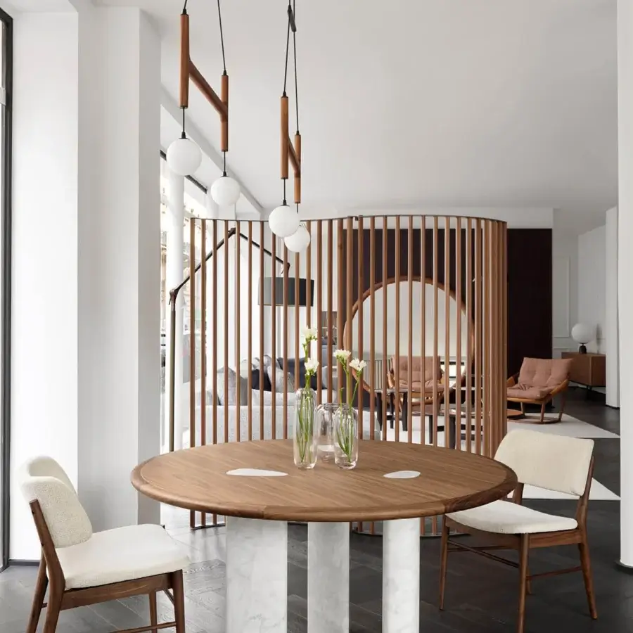 Distinctive Porada Osmose table crafted in canaletto walnut with polished marble legs and satin finish