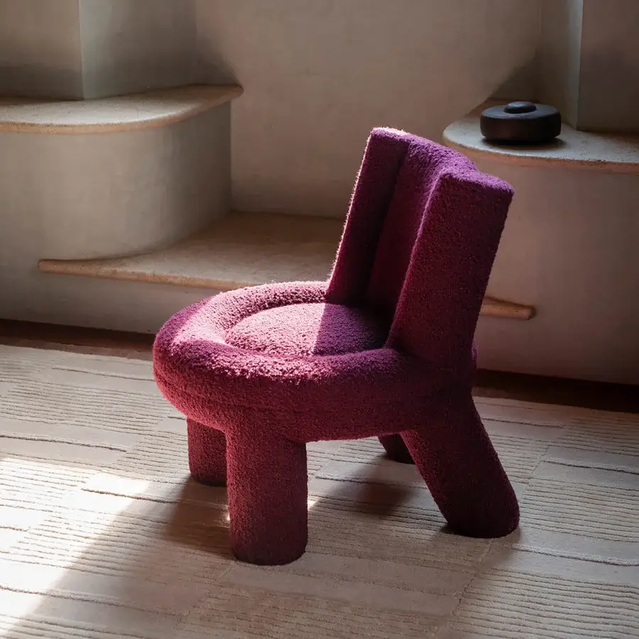 Lavish Potocco Softy lounge chair with saturated magenta upholstery crafted in textured stretch fabric—Bess, Cortina, Dolly or Uniform Melange by Kvadrat