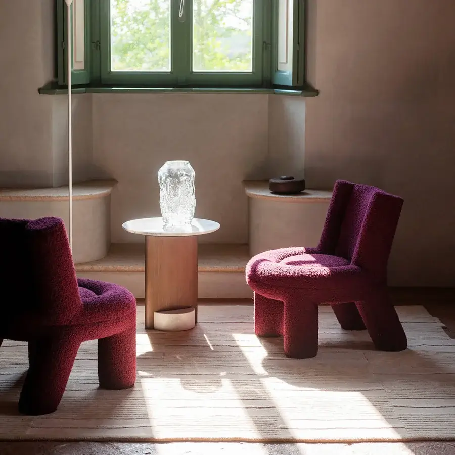 Distinguished Potocco Softy lounge chair with enveloping form and stretch fabric upholstery in a deep burgundy tone crafted in Italy