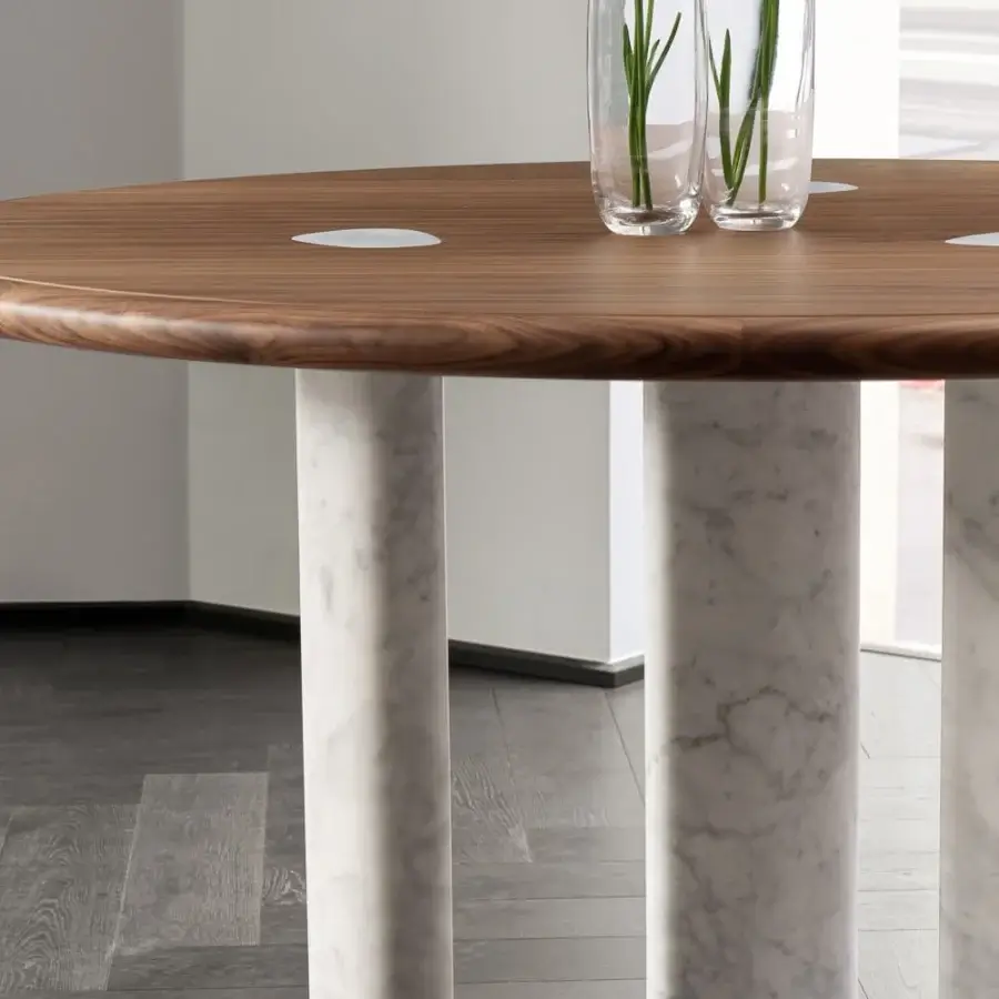 Distinctive Porada Osmose round table crafted with canaletto walnut and subtly veined marble legs with a polished finish