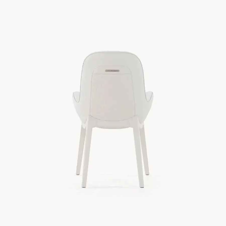 Superior Visionnaire Opus armchair with quilted off-white textile upholstery and polished stainless steel accents