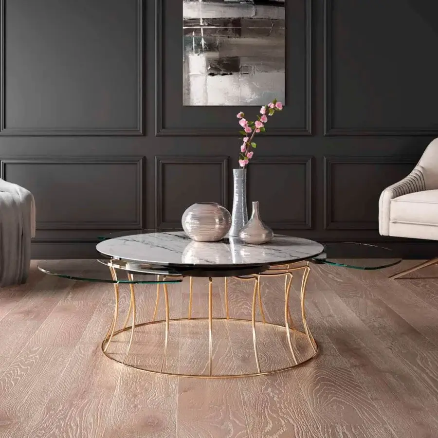 Superior Naos Les Jeux Sont Faits coffee table with rotating clear glass and ceramic top in golden-toned galvanized steel with glossy sheen