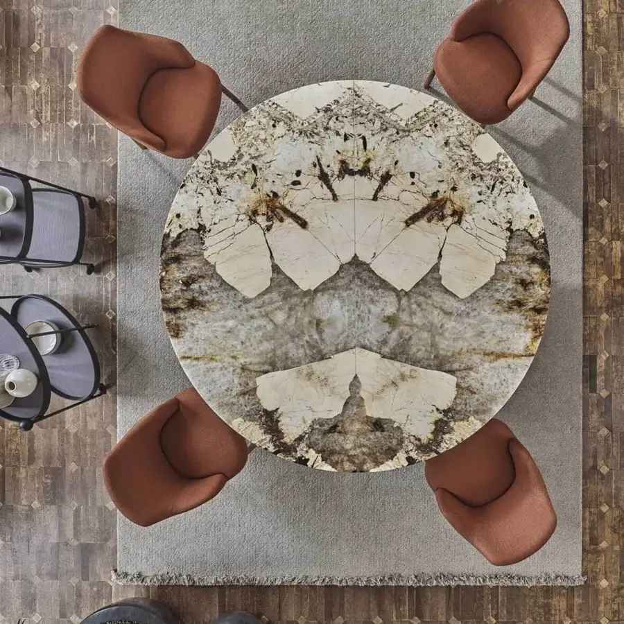 Distinguished Porada Sansiro round table with beige, brown, and gold veined marble top and sculpted canaletto walnut frame