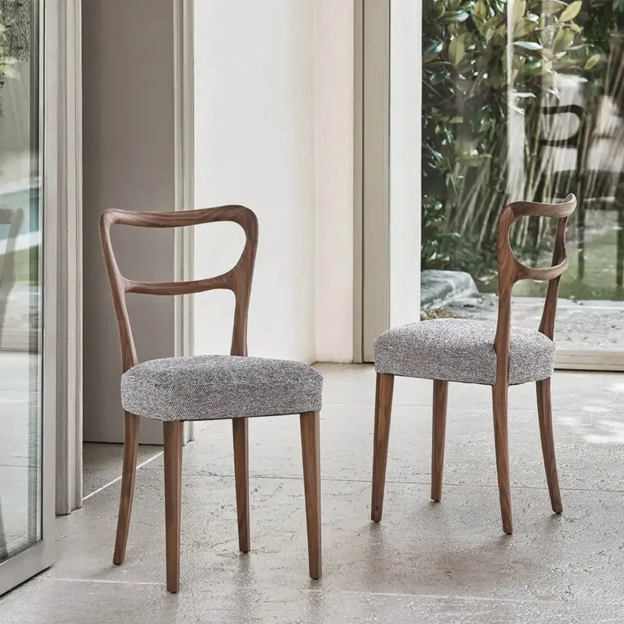 Distinguished Porada Noemi chair with solid Canaletta walnut frame and subtly textured light gray fabric upholstery