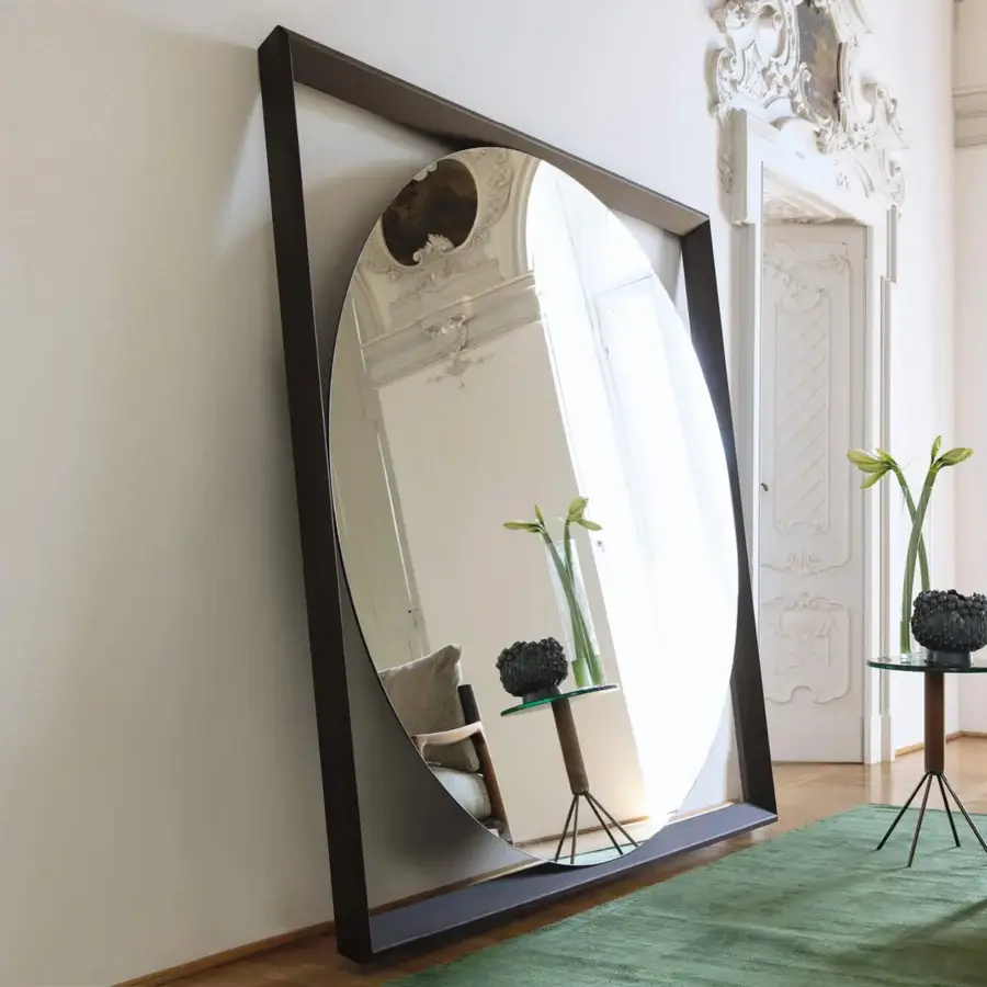 Exceptional Porada Odino mirror with a square ash-wood frame contrasting an oval reflective surface and satin dark brown finish