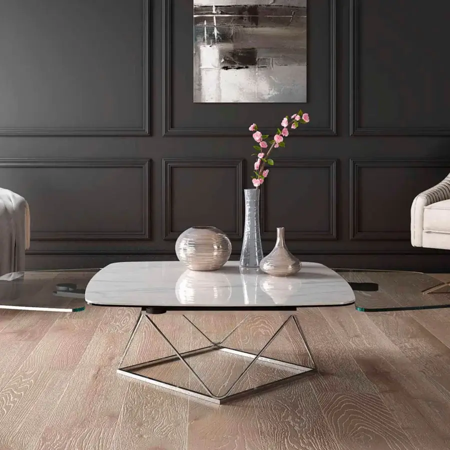 Distinguished Naos Uptown coffee table crafted with ceramic and glass in a white marble-like pattern plus polished galvanized steel base