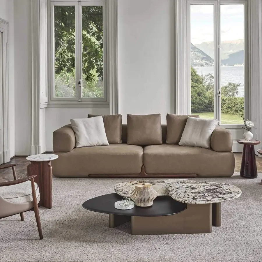 Lavish Porada Klem two-seater sofa with warm brown textile upholstery and a satin canaletto walnut frame