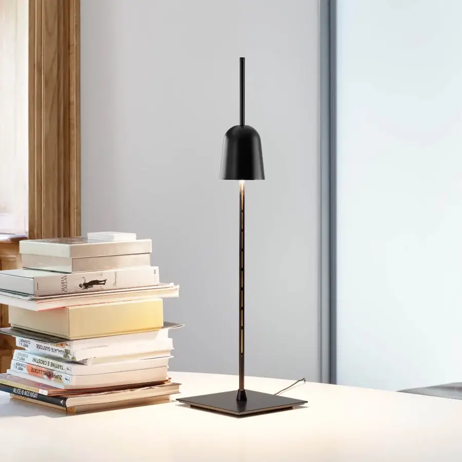 Innovative Luceplan Ascent table lamp crafted with lathed anodized aluminum, black technopolymer and painted steel in a matte black finish