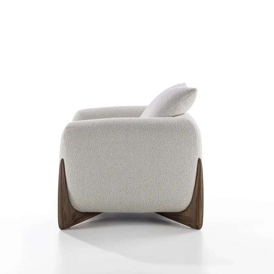 Distinguished Porada Softbay armchair with soft bouclé fabric upholstery in creamy off-white and matte Canaletta walnut end-feet