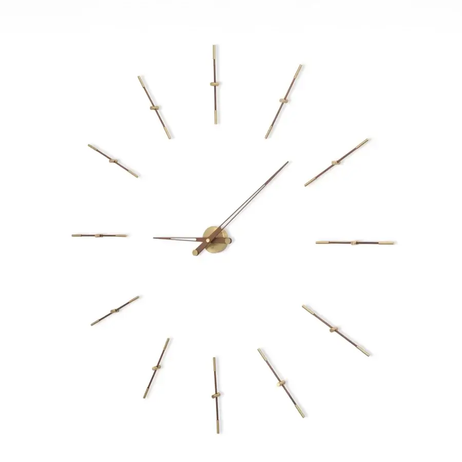 Elegant Nomon Merlín wall clock crafted with wood and metal in a smooth satin gold finish with floating time markers